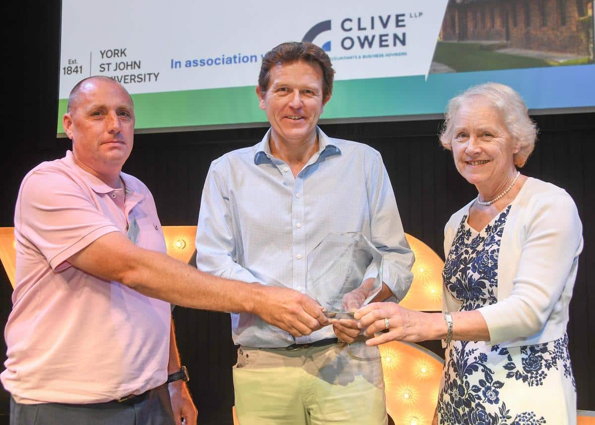 Simon Price Nick Atkison Collect the Top Manufacturer Award from Karen Bryan OBE